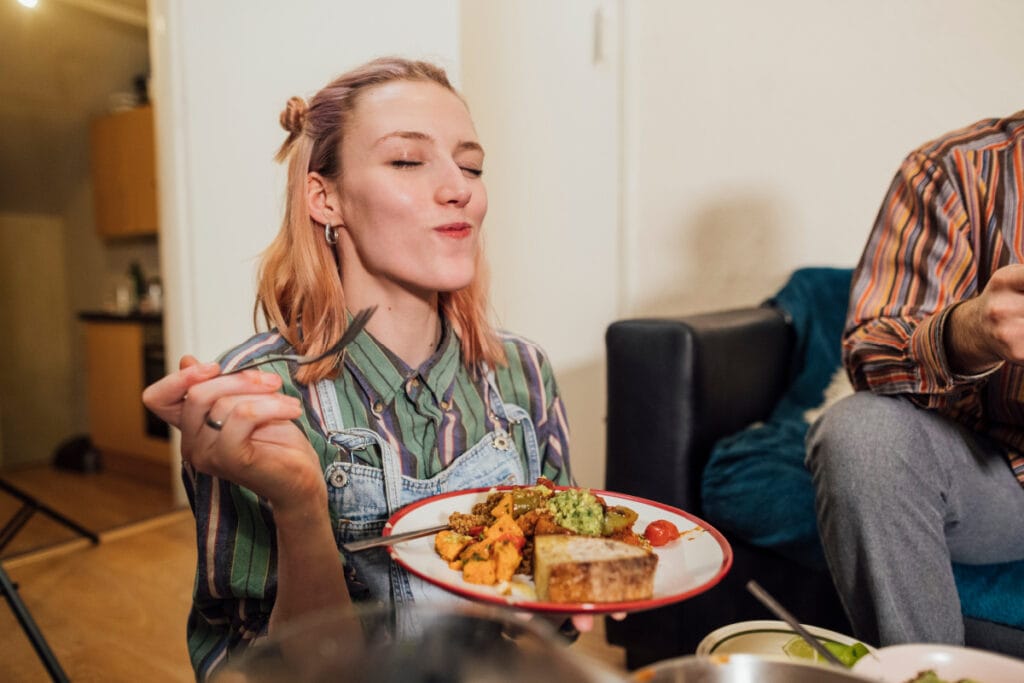 Woman eating healthy plate of seasonal fall foods